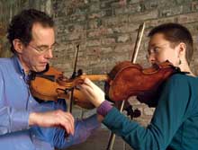 Bruce Sagan and lydia ievins playing fiddles